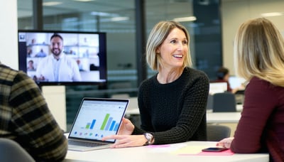 Consultant collaborating with clients on digital education strategies